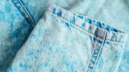 Blue jeans fabric with detailed texture, perfect for fashion and textile design visualsの写真素材