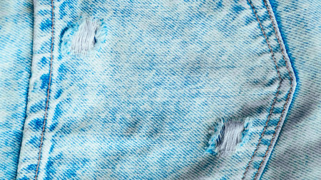 Blue jeans fabric with detailed texture, perfect for fashion and textile design visuals