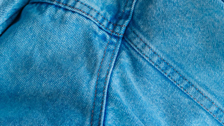 Blue jeans fabric with detailed texture, perfect for fashion and textile design visuals