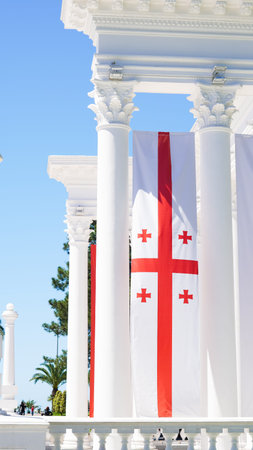 The flag of Georgia waves proudly in the park, symbolizing unity and heritage