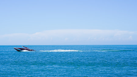 Boat sailing in the clear blue sea, a perfect scene of tranquility and beauty. High quality photoの写真素材