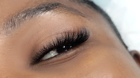 Close up of eye with eyelash extensions,beauty salon treatment,2d volume, 3d volume, classical...