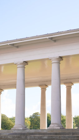 : Majestic antique English white columns from a historic building exteriorの写真素材