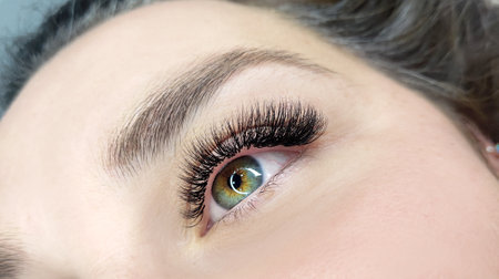 Close up of eye with eyelash extensions,beauty salon treatment.の写真素材