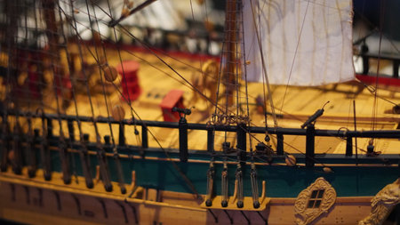 Ship models in maritime museum showcasing naval history, craftsmanship, and designの写真素材