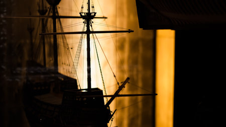 Close-up view of ship models in maritime museum, reflecting ancient sailing vessels..の写真素材
