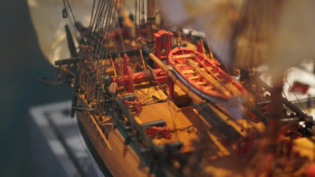 Ship models in maritime museum showcasing naval history, craftsmanship, and designの写真素材