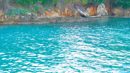 Serene blue sea background with calm waves and clear sky, perfect for nature-themed visuals...の写真素材