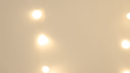 Soft blurred golden and brown bokeh with warm Christmas light reflections. High quality photoの写真素材