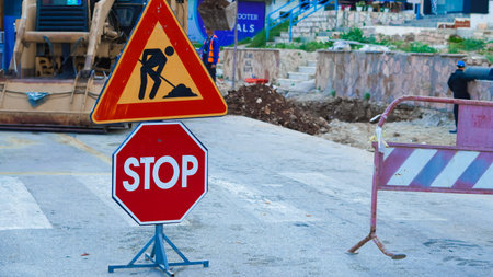 Construction zone with road signs on the street.