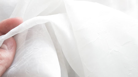 Romantic white veil background with airy layers and soft elegant textures