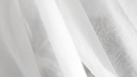 Romantic white veil background with airy layers and soft elegant texturesの写真素材