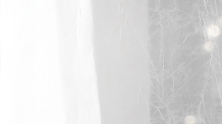Minimalist white veil background with soft textures and sheer elegant design.の写真素材