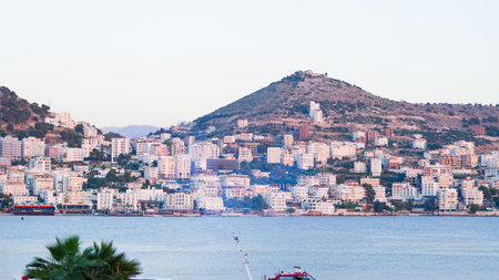 Stunning Albanian sunset over the sea, with Sarande seaside viewsの写真素材