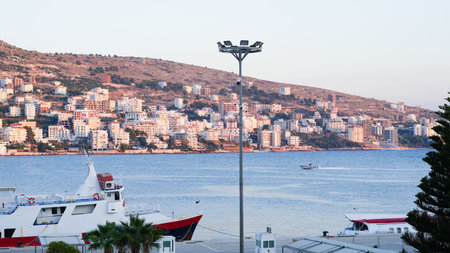 Stunning Albanian sunset over the sea, with Sarande seaside viewsの写真素材