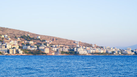 Stunning Albanian sunset over the sea, with Sarande seaside viewsの写真素材