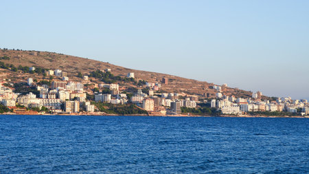 Stunning Albanian sunset over the sea, with Sarande seaside viewsの写真素材