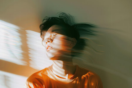 An adult struggling with ADHD focusing on daily tasks in a home settingの素材