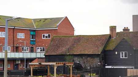 Overcast weather above English town rooftops in a quiet suburban areaの写真素材