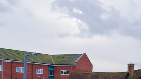 Overcast weather above English town rooftops in a quiet suburban areaの写真素材
