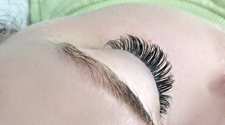 Close up of eye with eyelash extensions ,beauty salon treatment ,2d volume, 3d volume, classical lashes,Russian volume,megavolume, new set..の写真素材