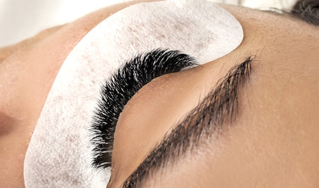 Close up of eye with eyelash extensions ,beauty salon treatment ,2d volume, 3d volume, classical...
