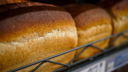 A variety of gluten-free bread displayed on a supermarket shelf for buyersの写真素材