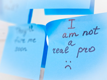 Sticky notes represent self-doubt and the emotional struggle of imposter syndromeの写真素材