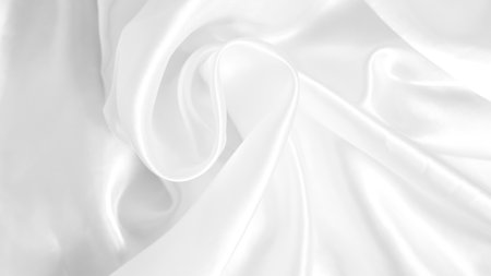 White silk with subtle folds, creating a soft and clean backgroundの写真素材