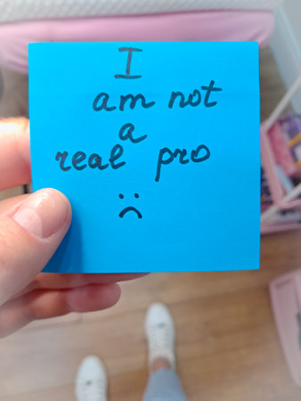 The feeling of being an imposter visualized through sticky notes and doubts.の写真素材