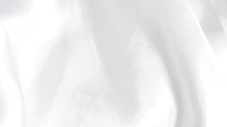 White silk with subtle folds, creating a soft and clean backgroundの写真素材
