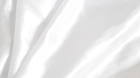 White silk with subtle folds, creating a soft and clean backgroundの写真素材
