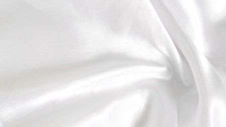 White silk with subtle folds, creating a soft and clean backgroundの写真素材