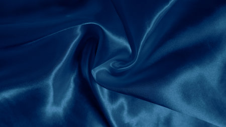 Dreamy silk texture in soft blue shades with flowing waves and delicate glowの写真素材