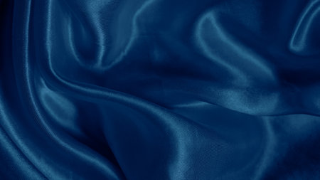 Dreamy silk texture in soft blue shades with flowing waves and delicate glowの写真素材