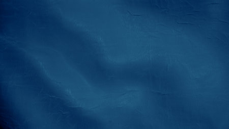 Abstract blue silk waves reflecting light with a gentle luminous glowの写真素材