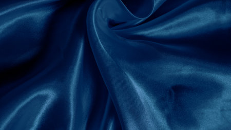 Soft blue silk folds create a hypnotic effect with smooth flowing patternsの写真素材