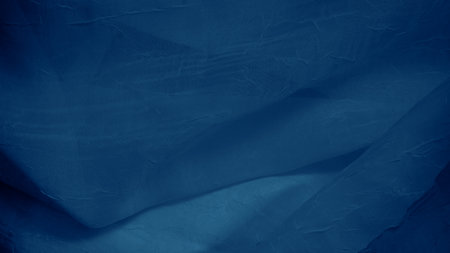Abstract blue silk waves reflecting light with a gentle luminous glowの写真素材
