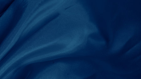 Abstract blue silk waves reflecting light with a gentle luminous glowの写真素材