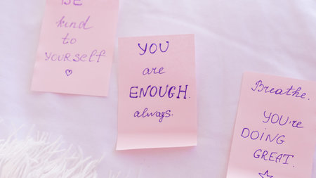 Emotional pink stickers with positive words for daily inner balance.の写真素材
