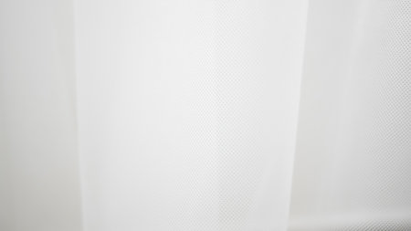 Sheer white tulle texture ideal for modern backgrounds or styling layers.の写真素材