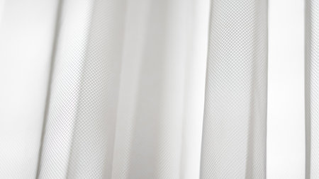 White netted tulle backdrop with light flow and delicate modern aesthetic.の写真素材