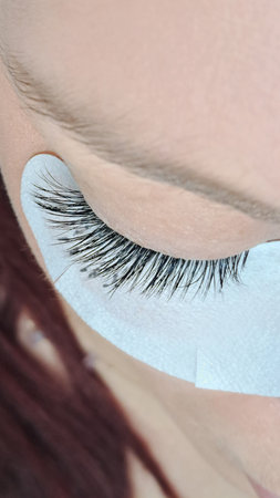 close up of eyelash extensions in beauty salon macro eye.の写真素材
