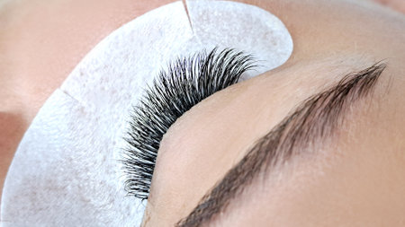 Close up of eye with eyelash extensions,beauty salon treatment,2d volume, 3d volume, classical lashes,Russian volume,megavolume, new set.の写真素材