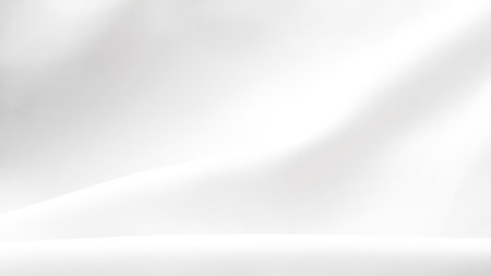 Clean white silk fabric folds creating smooth luxury minimal backdrop texture.の写真素材