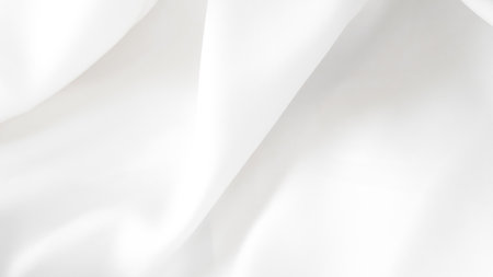 White silk textile with natural folds in neutral light used for photo styling.の写真素材