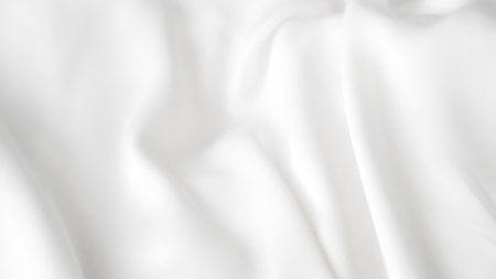 :White silk background with calm folds in luxury cosmetic product layout.の写真素材