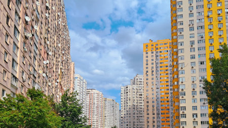 Colorful apartment blocks with multiple floors and air conditioning units.の写真素材