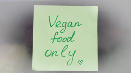 Sticky note reminders on kitchen refrigerator promoting healthy eating and wellness.の写真素材