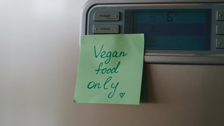 Healthy food reminders and motivational sticky notes on modern refrigerator.の写真素材